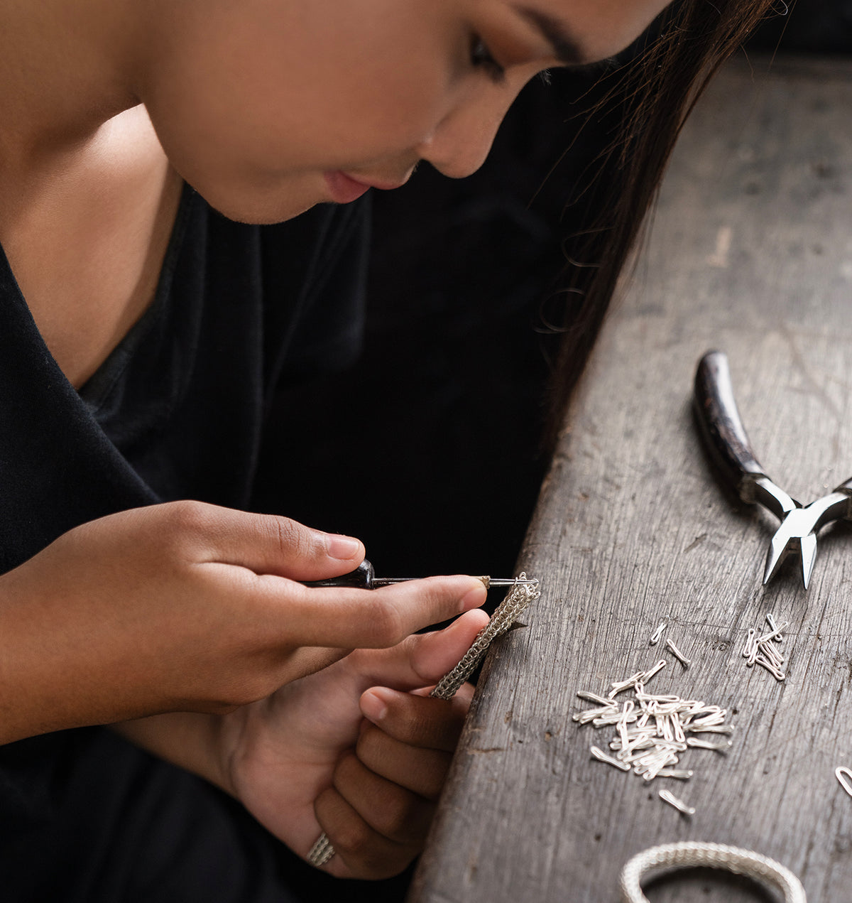 Yesa, a John Hardy chain-weaving artisan, at her workbench