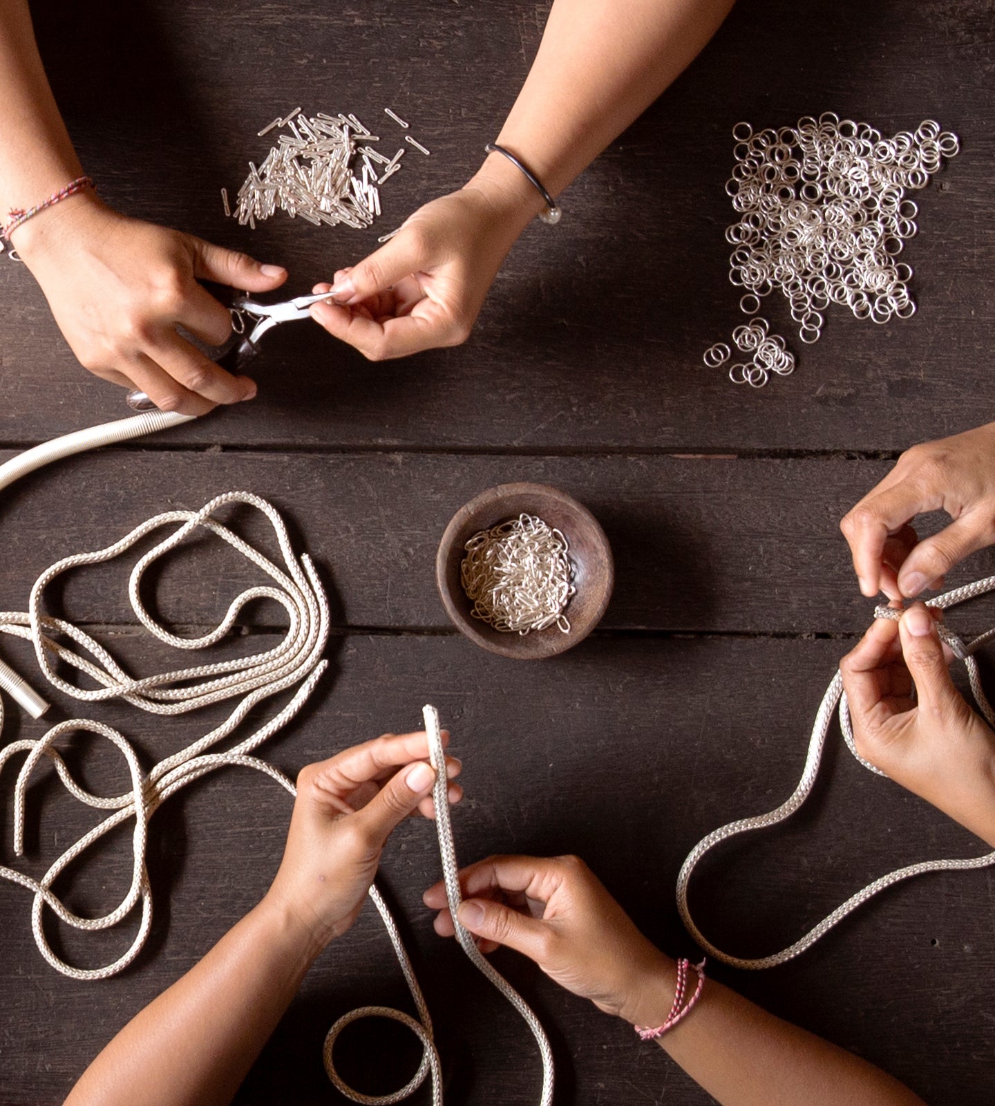 John Hardy artisans weaving silver chain by hand